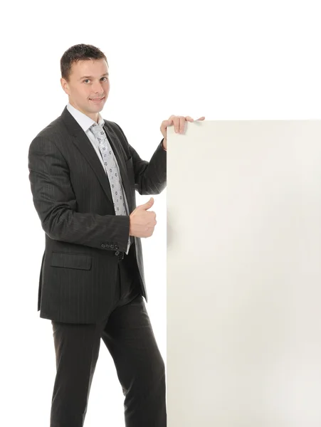 Young man with blank sheet — Stock Photo, Image