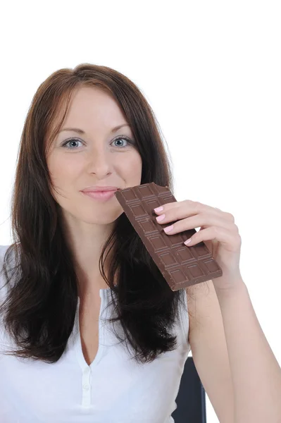 Mädchen isst Schokolade. — Stockfoto