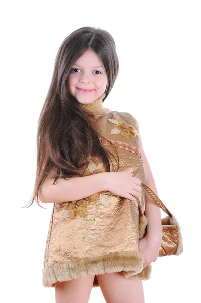 Little girl in a gold dress — Stock Photo, Image