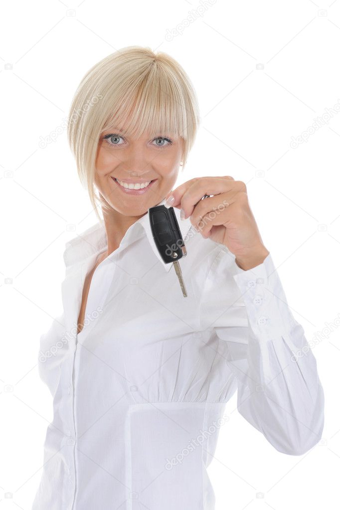 Woman holds the key to the car. Isolated on white background