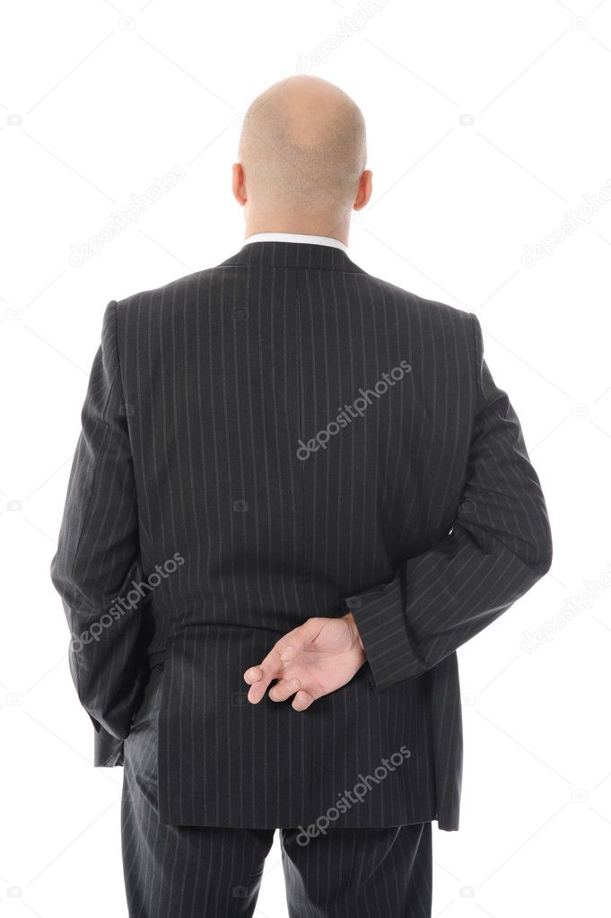 Businessman with crossed fingers at back