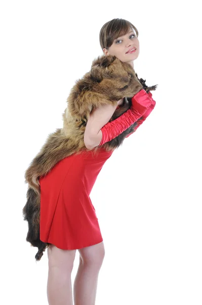 Mooi meisje in de rode jurk. — Stockfoto