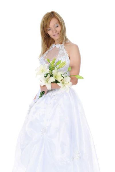 Happy bride with a bouquet of lilies — Stock Photo, Image