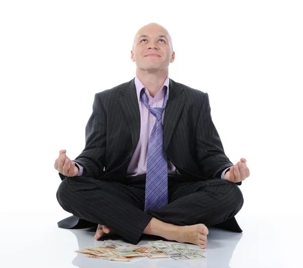 Businessman meditating in yoga lotus — Stock Photo, Image