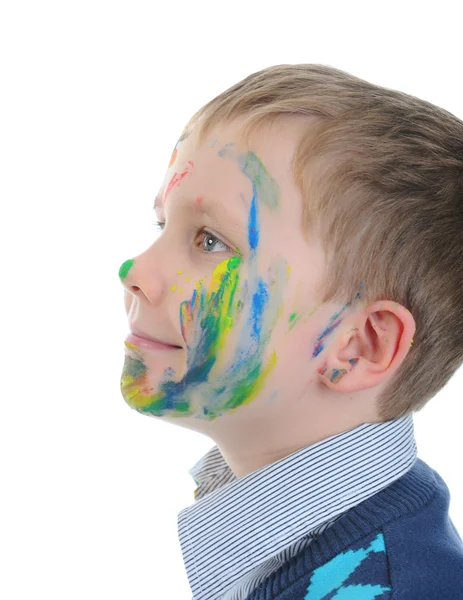 Niño con la cara manchada de pintura —  Fotos de Stock