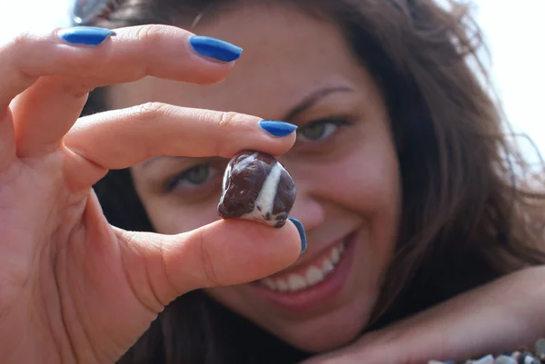 Woman showing stone