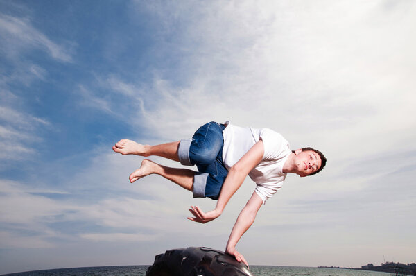 Young man jumping on the beach