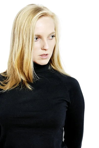 Portrait of a young blonde woman in a black sweater — Stock Photo, Image