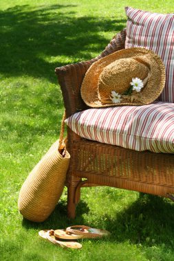 Wicker chair on the grass clipart