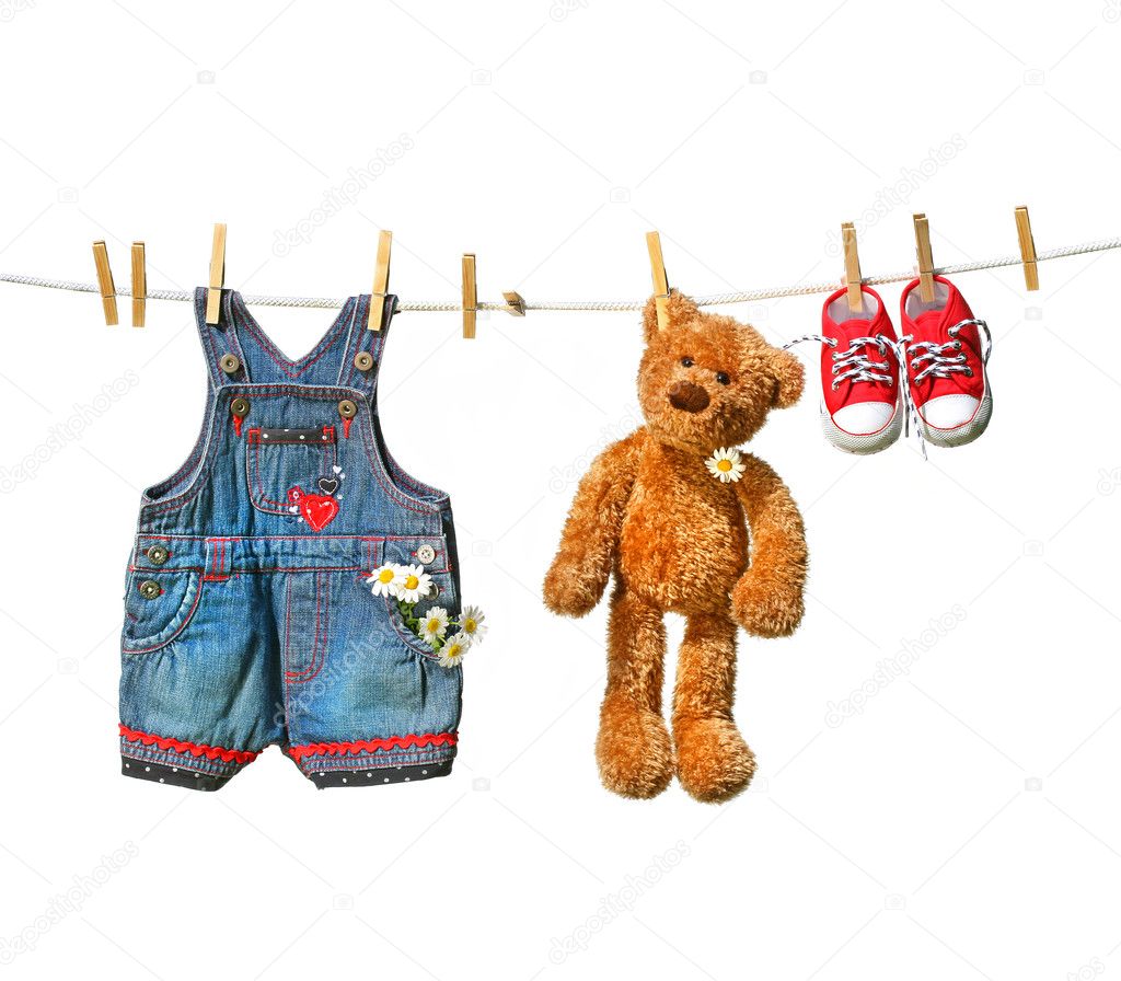 Clothes with teddy bear on clothesline