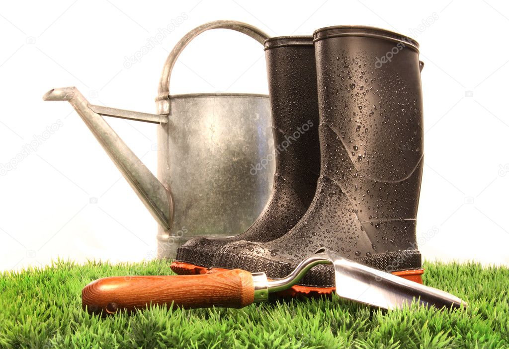 Garden boots with tool and watering can