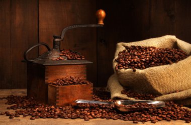 Antique coffee grinder with beans clipart