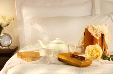 Tea in bed with chocolates clipart