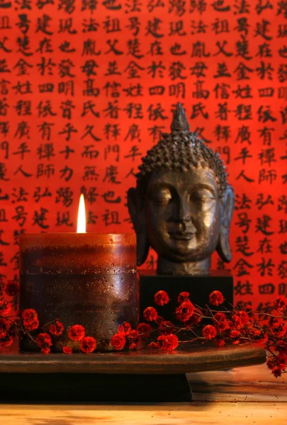 Asian candle with red orential background — Stock Photo, Image