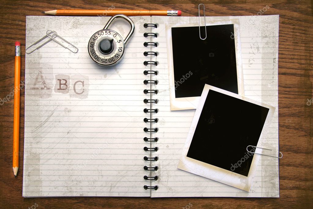 White copy book, pencils and photos