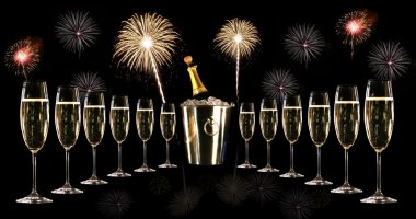 Glasses of champagne with silver ice bucket and fireworks clipart