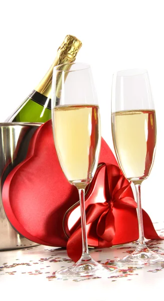 Champagne glasses with valentine gifts on white — Stock Photo, Image