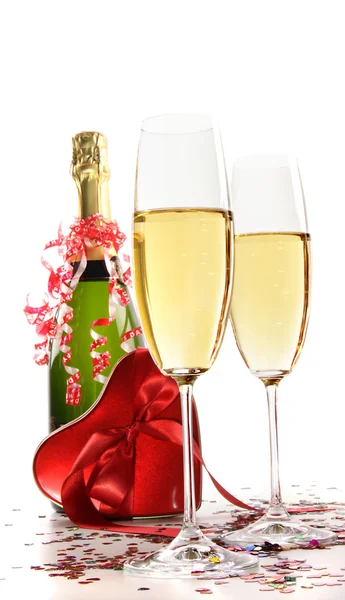 Glasses of champagne with red ribbon heart — Stock Photo, Image
