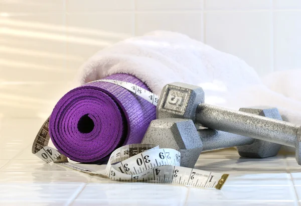 Excerise mat with weights — Stock Photo, Image