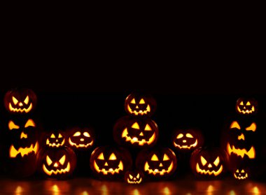 Lots of pumpkins lit brightly clipart