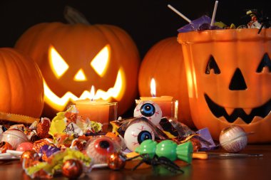 Closeup of candies with pumpkins clipart