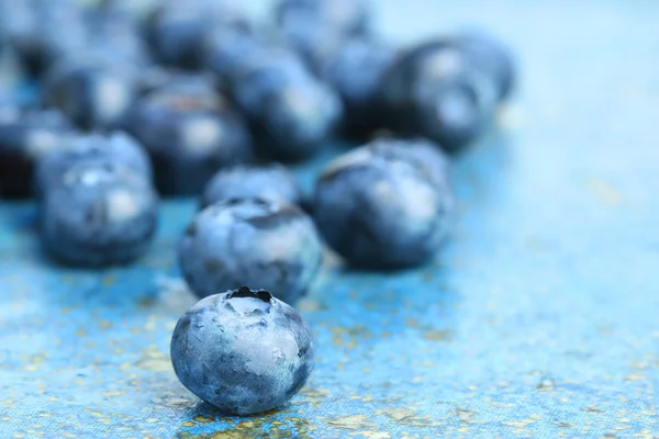 Blueberries on blue background — Stock Photo, Image