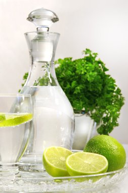 Fresh limes and water clipart