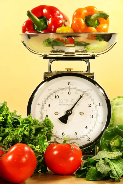 Vegetables on kitchen scale — Stock Photo, Image