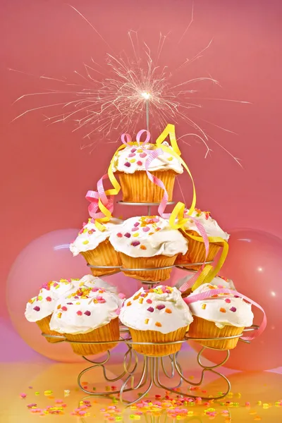 Cupcakes with sparkler on top — Stock Photo, Image