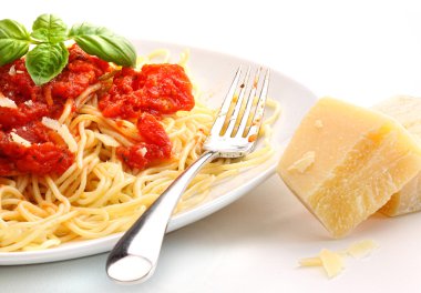 Spagettini noodles with homemade tomato sauce and basil clipart