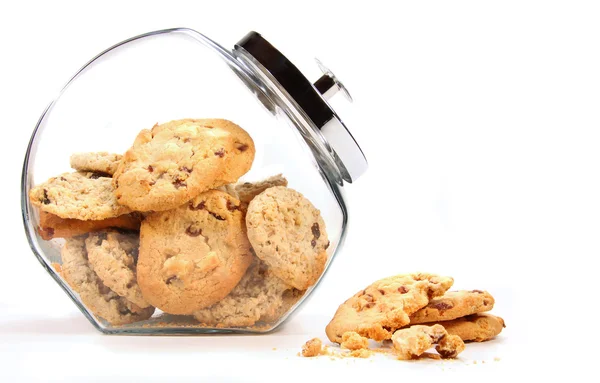Glass jar with cookies against a white — Stock Photo, Image