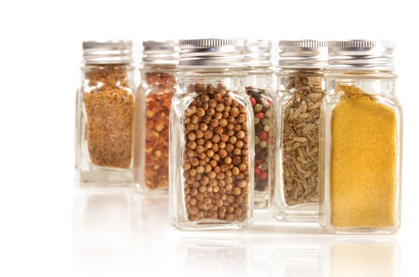 Assorted spice jars isolated on white — Stock Photo, Image