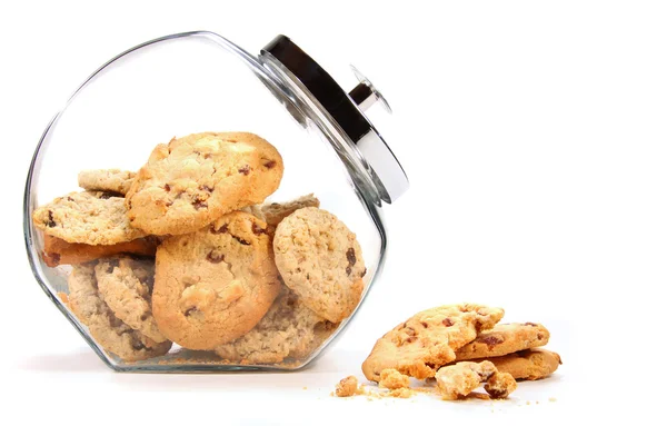 Glass jar with cookies against a white — Stock Photo, Image