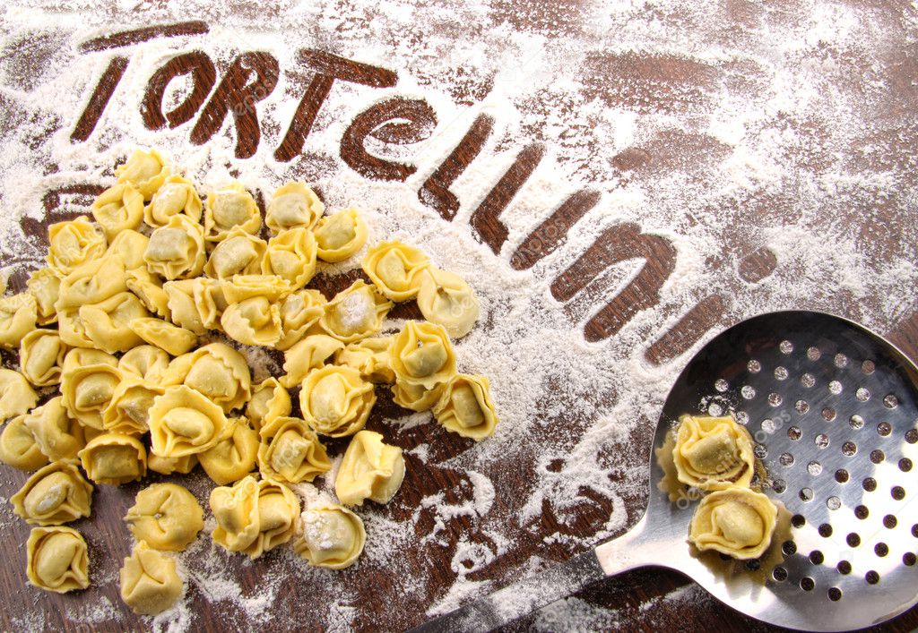 Fresh, raw tortellini with flour