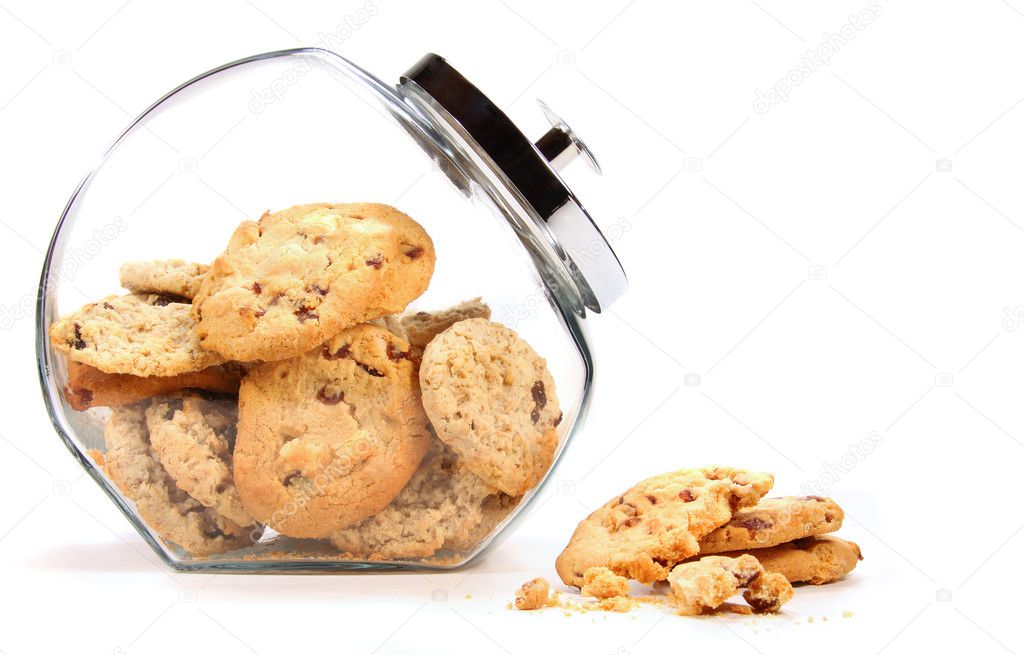 Glass jar with cookies against a white