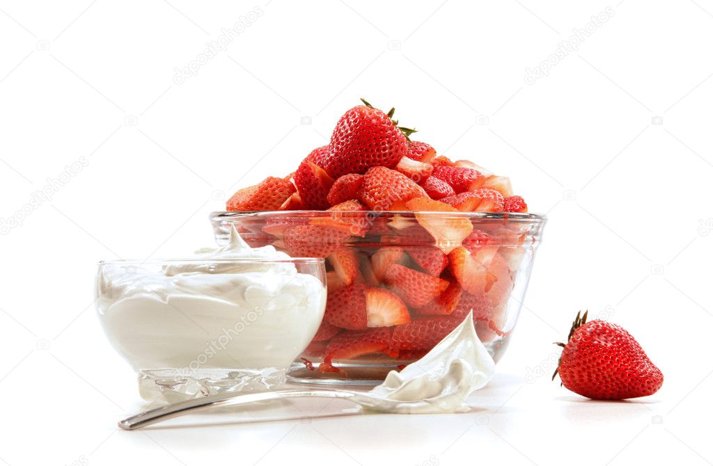 Fresh strawberries with whipped cream on white