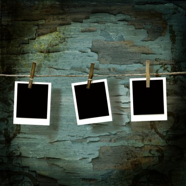 Polaroid pictures against old crackled backdrop clipart