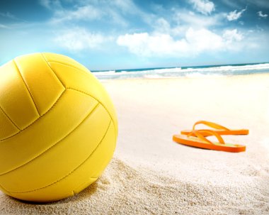 Volleyball in the sand with sandals clipart