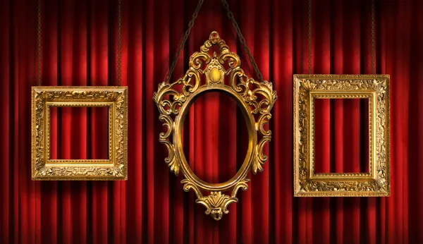 Red drapes with three gold frames — Stock Photo, Image