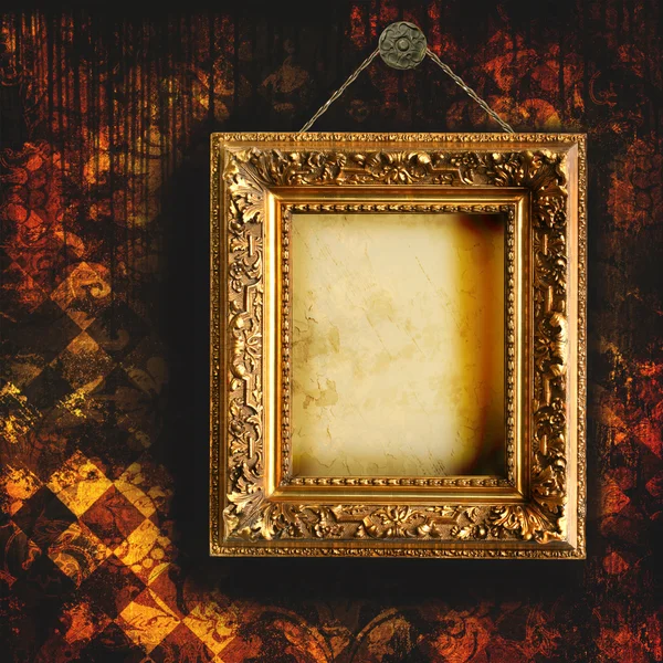 Grungy tattered wallpaper with empty picture frame — Stock Photo, Image