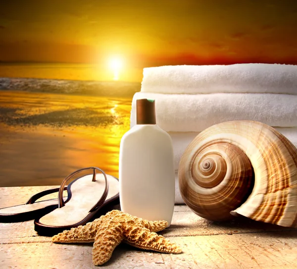 Beach accessories with a golden sunset Royalty Free Stock Images