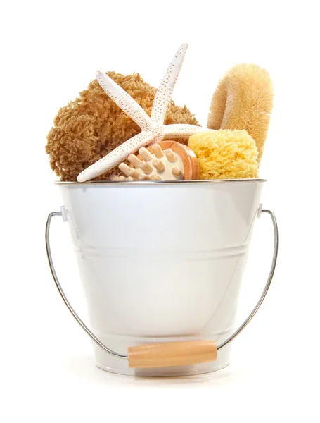 White bucket filled with sponges, brushes and starfish — Stock Photo, Image