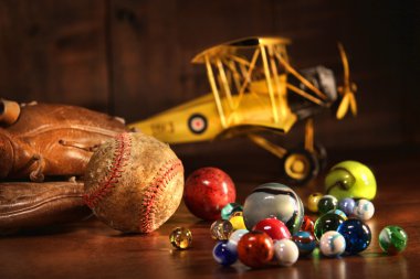 Old baseball and glove with antique toys clipart