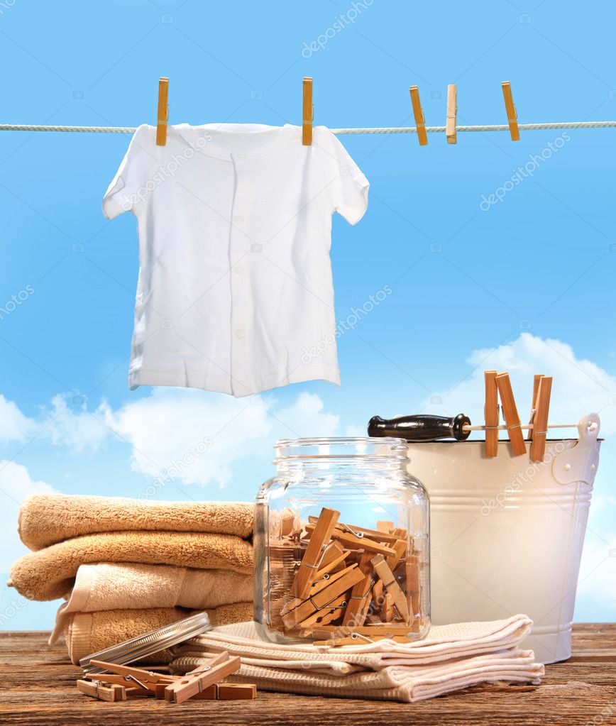 Laundry day with towels, clothespins on table