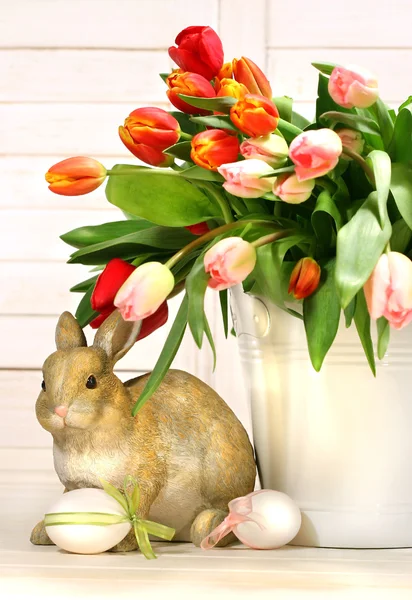 Little rabbit behind white container — Stock Photo, Image