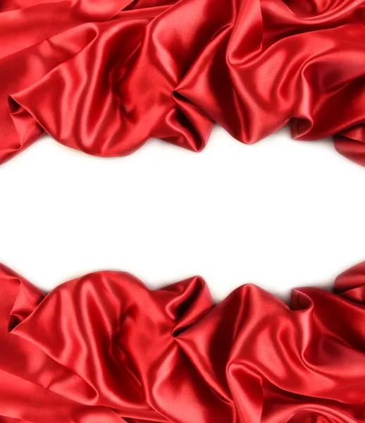 Червона атласна тканина проти білого — стокове фото