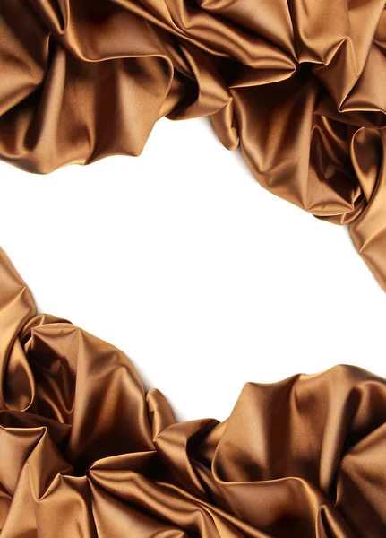 stock image Rich golden brown satin fabric on white