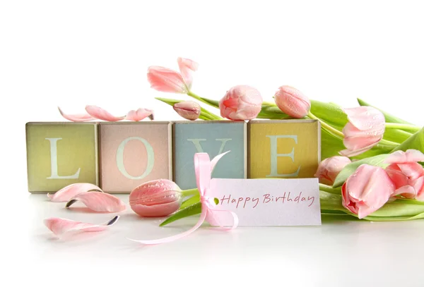 Wooden blocks with tulips and gift card — Stok fotoğraf