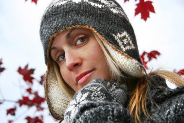 Young woman with winter hat clipart