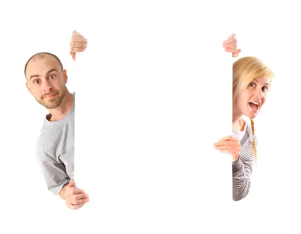 Man and woman holding white board — Stock Photo, Image